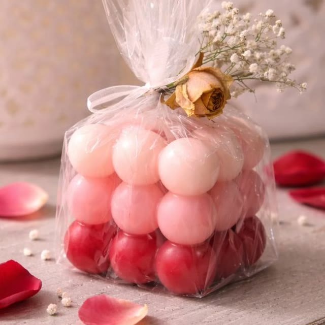 Ombre Valentine's Bubble wrapped in cellophane with a dried rose and baby's breath
